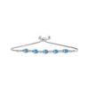 Thumbnail Image 1 of Oval-Cut Swiss Blue Topaz & White Lab-Created Sapphire Bolo Bracelet Sterling Silver