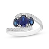 Thumbnail Image 1 of Memories Moments Magic Oval-Cut Blue Lab-Created Sapphire & Diamond Three-Stone Bypass Ring 1/8 ct tw Sterling Silver