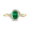 Thumbnail Image 2 of Oval-Cut Lab-Created Emerald & Diamond Bypass Ring 1/15 ct tw 10K Yellow Gold