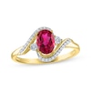 Thumbnail Image 1 of Oval-Cut Lab-Created Ruby & Diamond Bypass Ring 1/15 ct tw 10K Yellow Gold