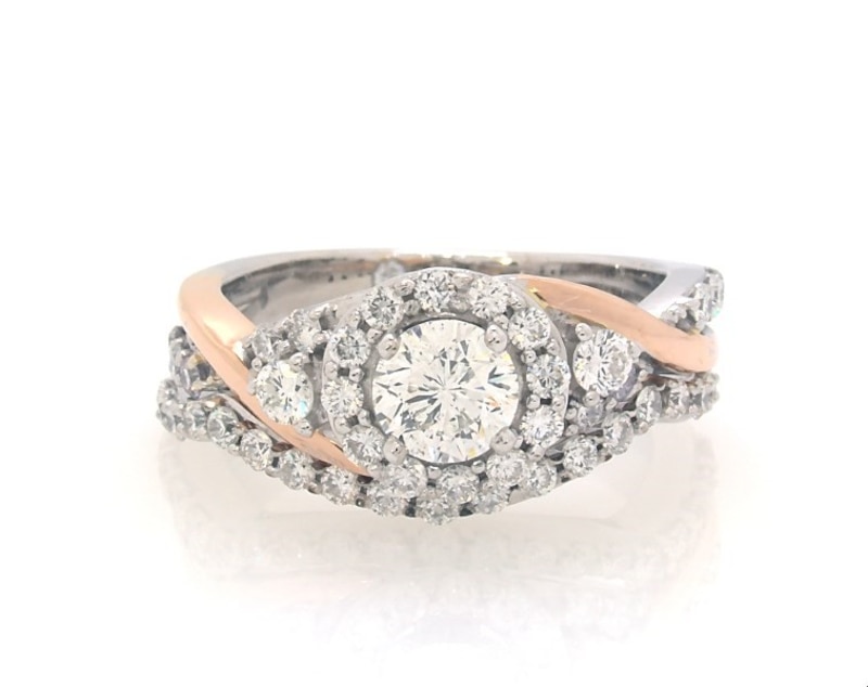 Main Image 1 of Previously Owned THE LEO Diamond Round-Cut Halo Twist Bridal Set 1-1/5 ct tw 14K Two-Tone Gold